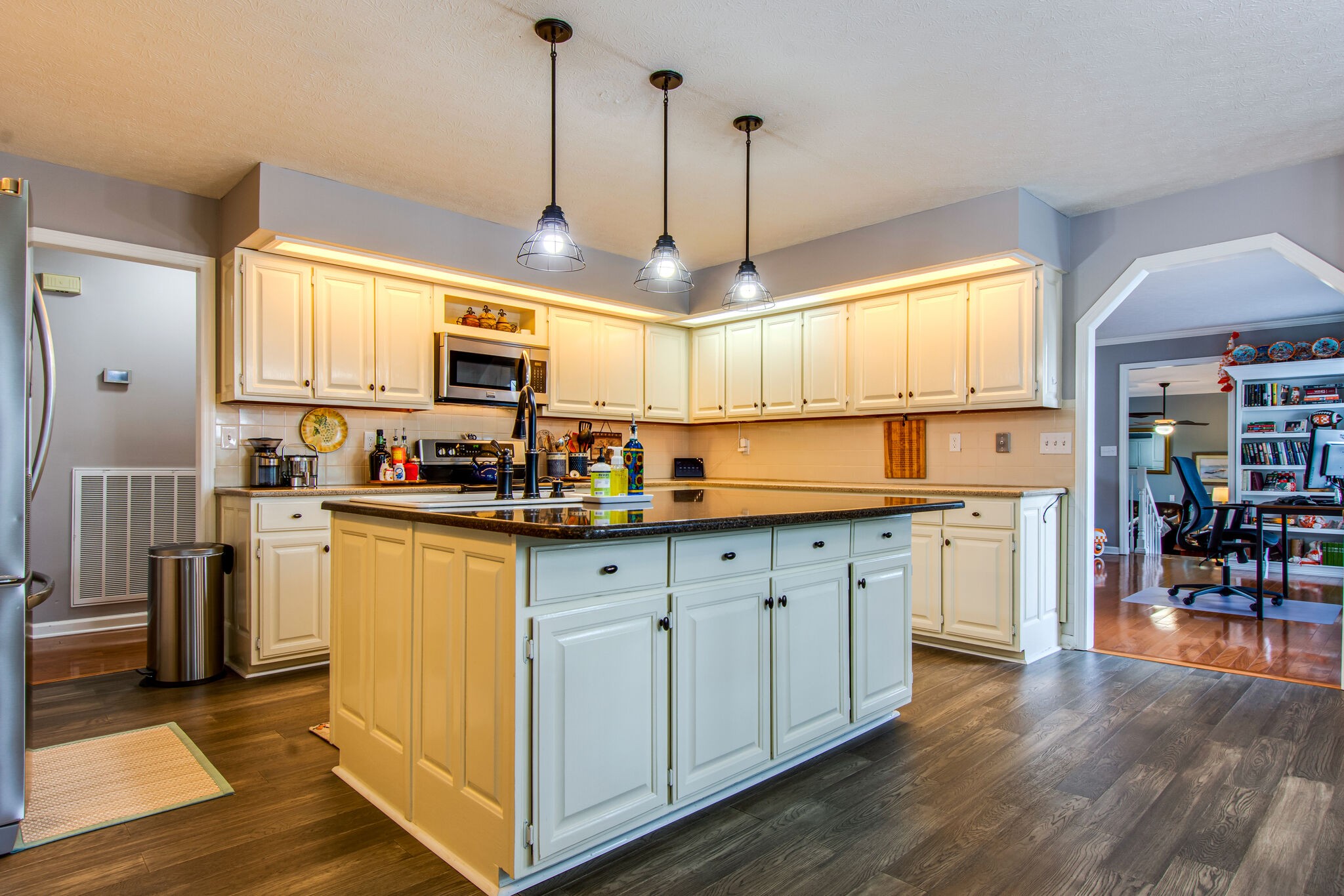 5175 Hickory Ridge Road Lebanon, TN 37087 - Photo 15 of 49 a kitchen with granite countertop wooden floors and white cabinets