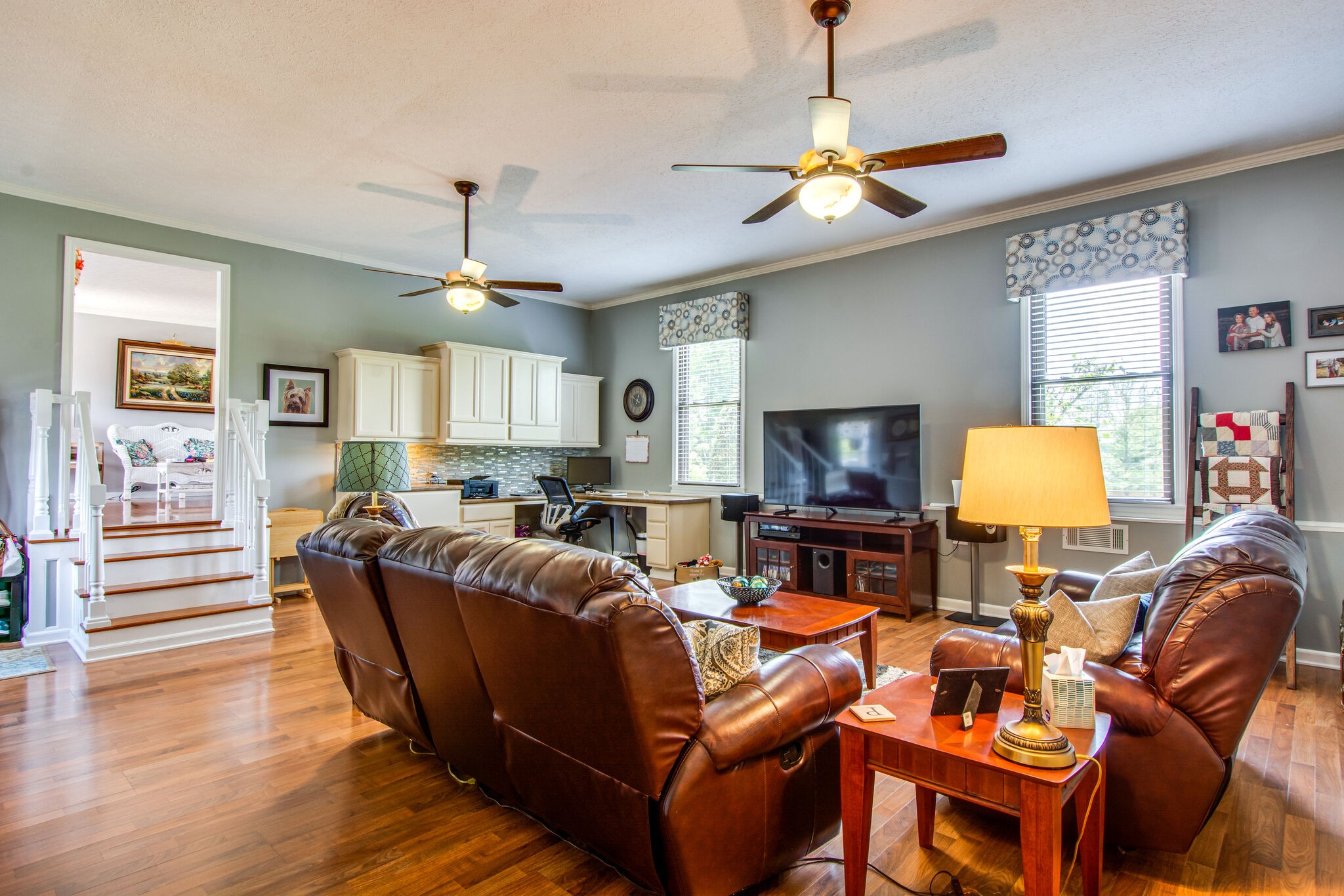 5175 Hickory Ridge Road Lebanon, TN 37087 - Photo 16 of 49 a living room with furniture a chandelier and a flat screen tv