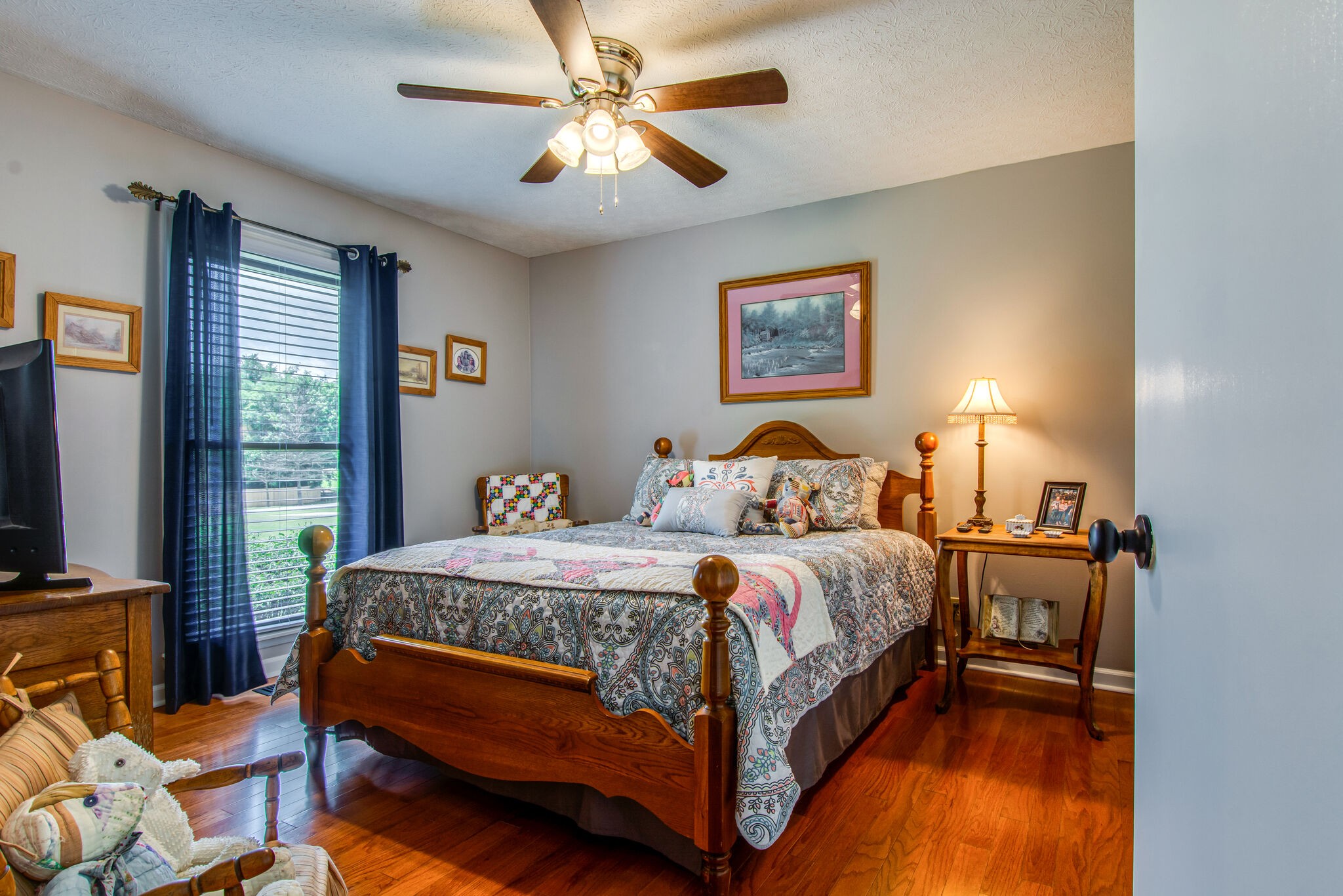 5175 Hickory Ridge Road Lebanon, TN 37087 - Photo 20 of 49 a bedroom with a bed a window and a flat screen tv