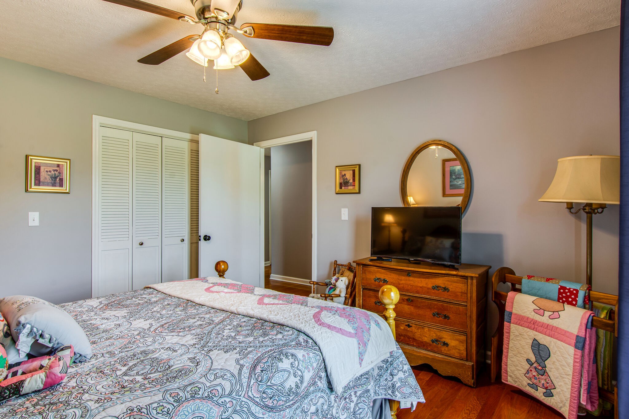 5175 Hickory Ridge Road Lebanon, TN 37087 - Photo 21 of 49 a bedroom with a bed and a flat tv screen on dresser