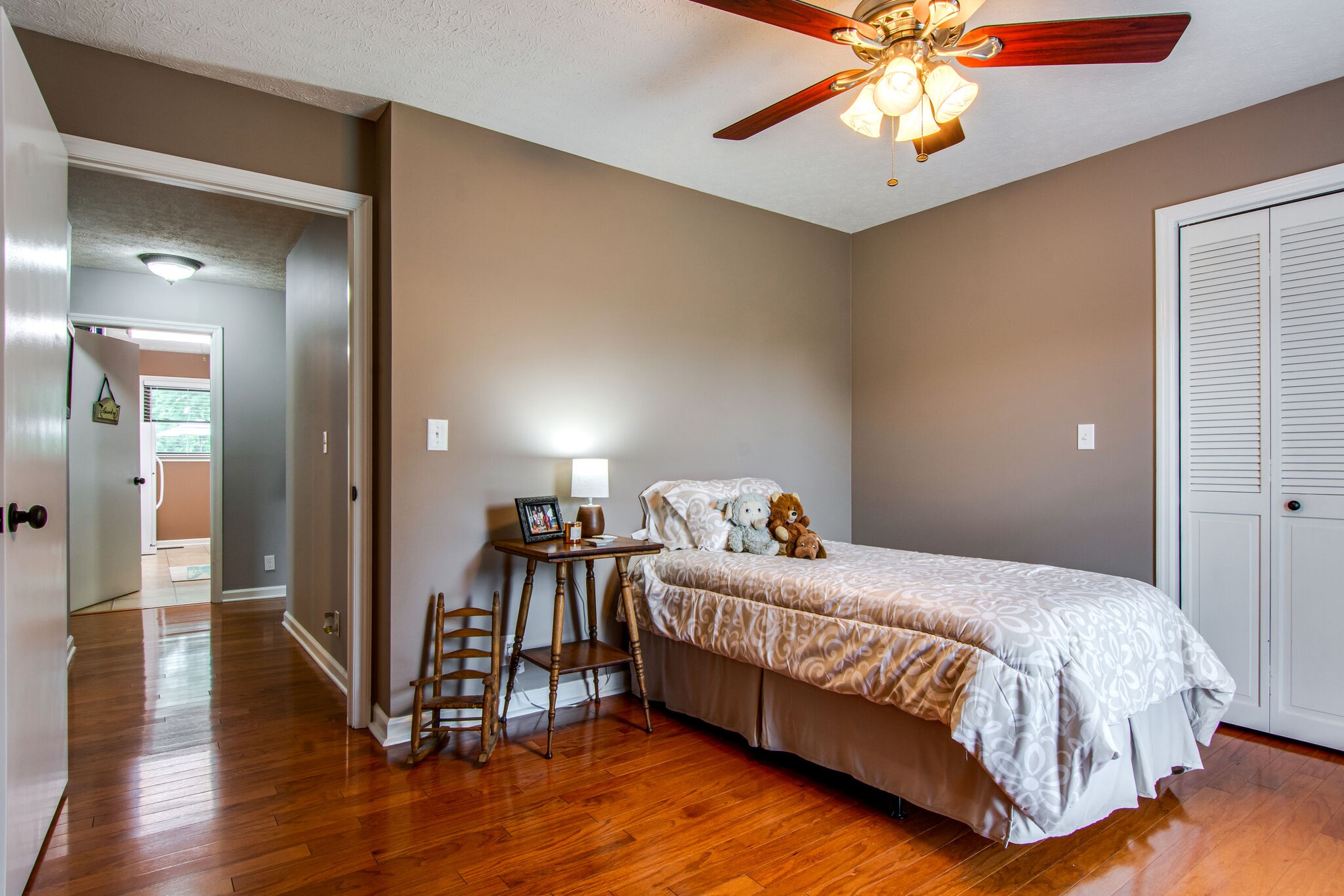 5175 Hickory Ridge Road Lebanon, TN 37087 - Photo 23 of 49 a bedroom with a bed and a chandelier