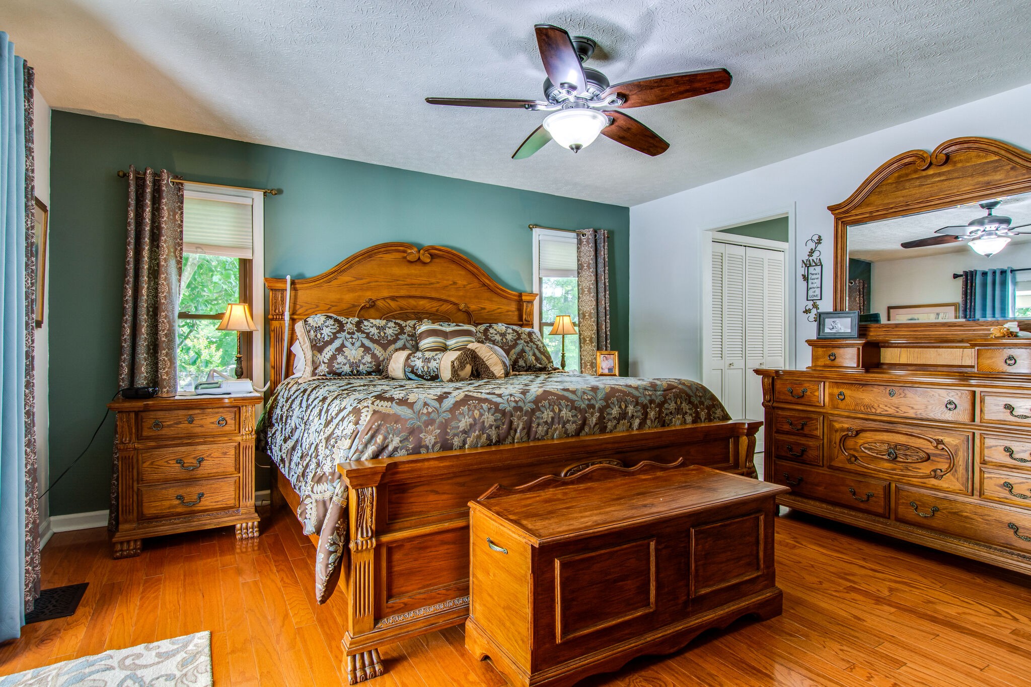 5175 Hickory Ridge Road Lebanon, TN 37087 - Photo 27 of 49 a bedroom with a bed and a chandelier