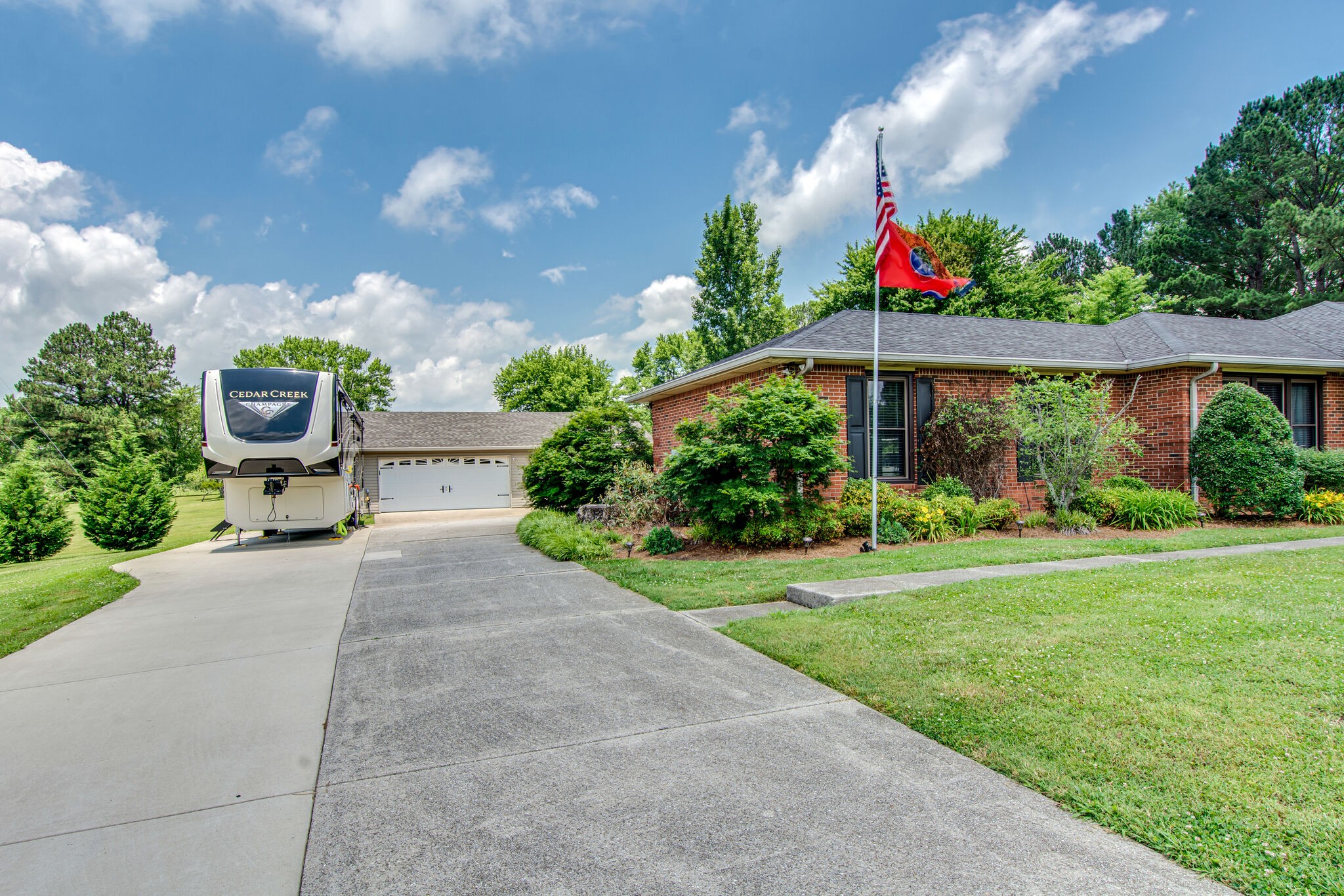 5175 Hickory Ridge Road Lebanon, TN 37087 - Photo 3 of 49 a front view of a house with a yard and potted plants
