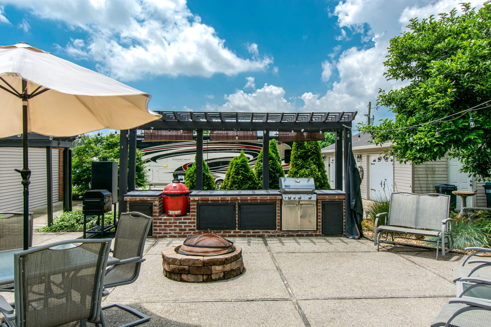 5175 Hickory Ridge Road Lebanon, TN 37087 - Photo 37 of 49 a patio with a table and chairs and potted plants