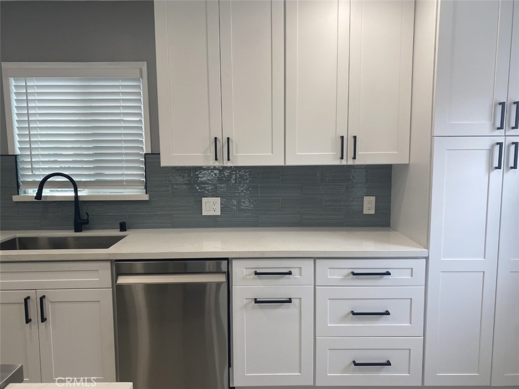 5591 Vallecito Avenue Westminster, CA 92683 - Photo 12 of 37 a kitchen with a sink and cabinets