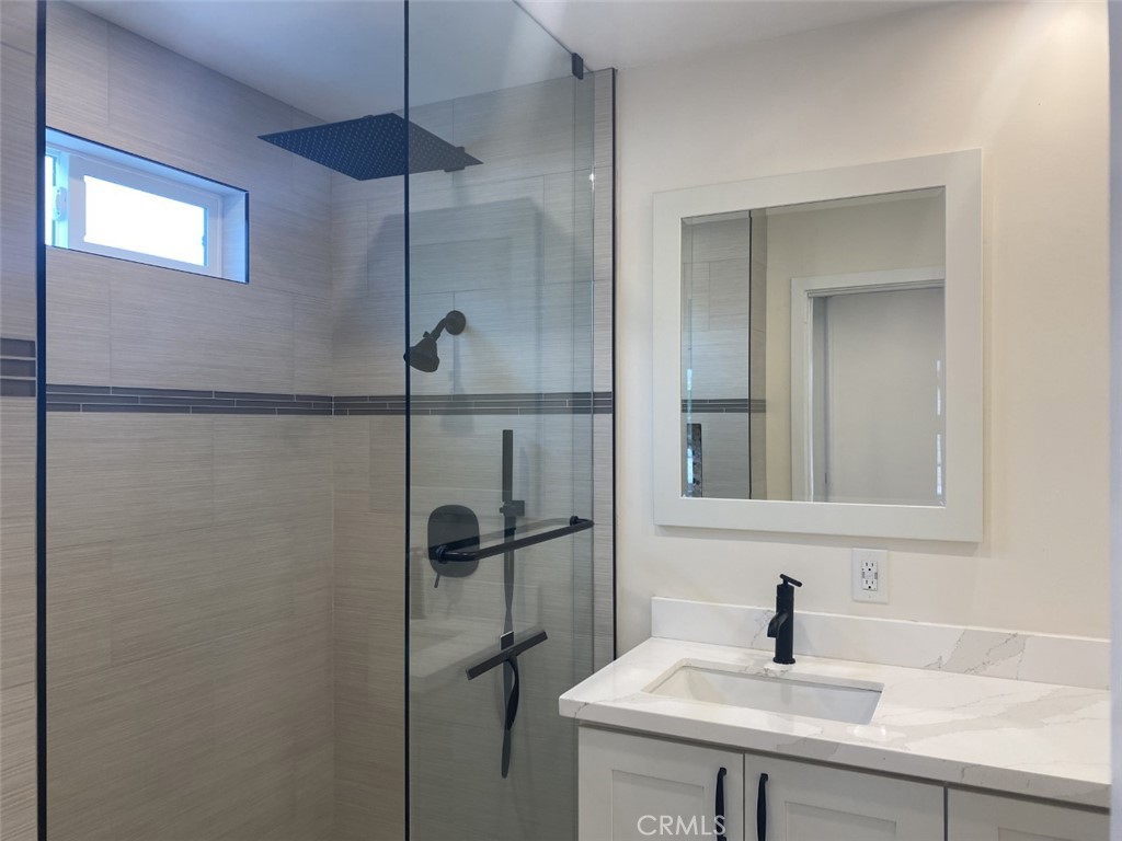 5591 Vallecito Avenue Westminster, CA 92683 - Photo 19 of 37 a bathroom with a sink and mirror