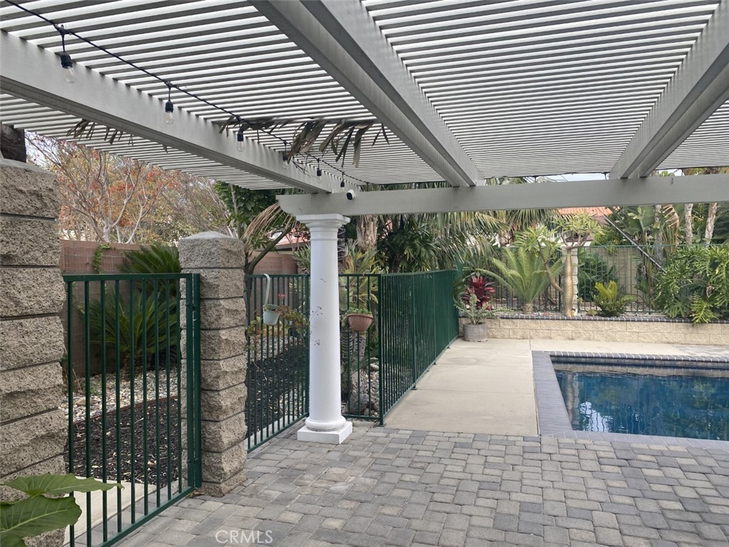 5591 Vallecito Avenue Westminster, CA 92683 - Photo 28 of 37 a view of a patio with table and chairs and wooden fence