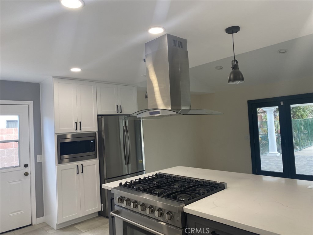 5591 Vallecito Avenue Westminster, CA 92683 - Photo 8 of 37 a kitchen with stainless steel appliances granite countertop a refrigerator and a stove