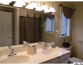 19226 Lahaina Lane Fort Mill, SC 29708 - Photo 11 of 13 a bathroom with a sink and a mirror