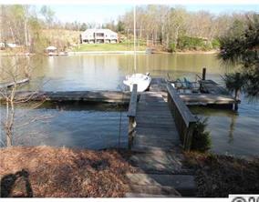 19226 Lahaina Lane Fort Mill, SC 29708 - Photo 4 of 13 a view of a lake with boats and trees in the background