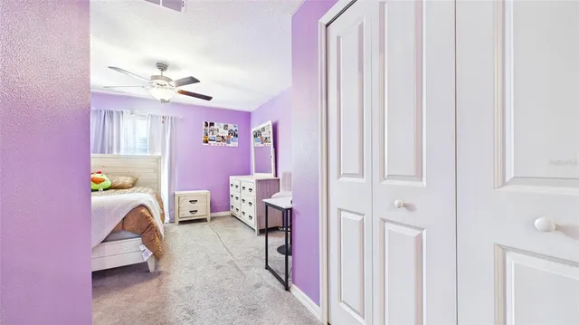 a view of hall way with furniture