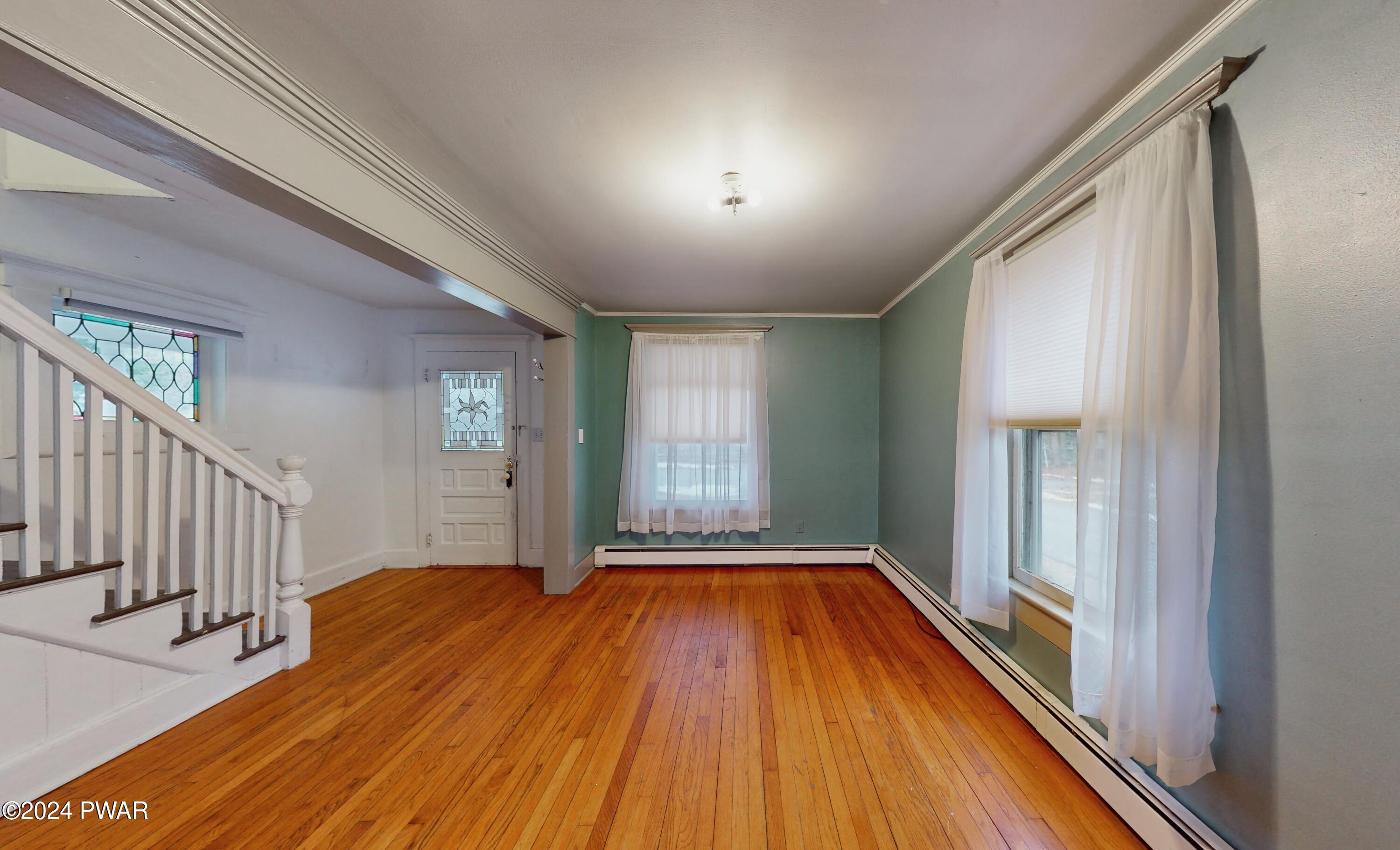 108 9th Street Milford, PA 18337 - Photo 5 of 38 a view of a room with wooden floor and balcony