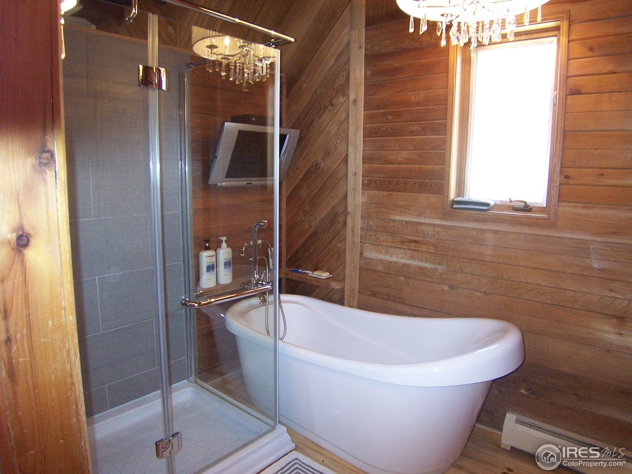 6419 Olde Stage Road Boulder, CO 80302 - Photo 14 of 21 a white bath tub sitting next to a shower