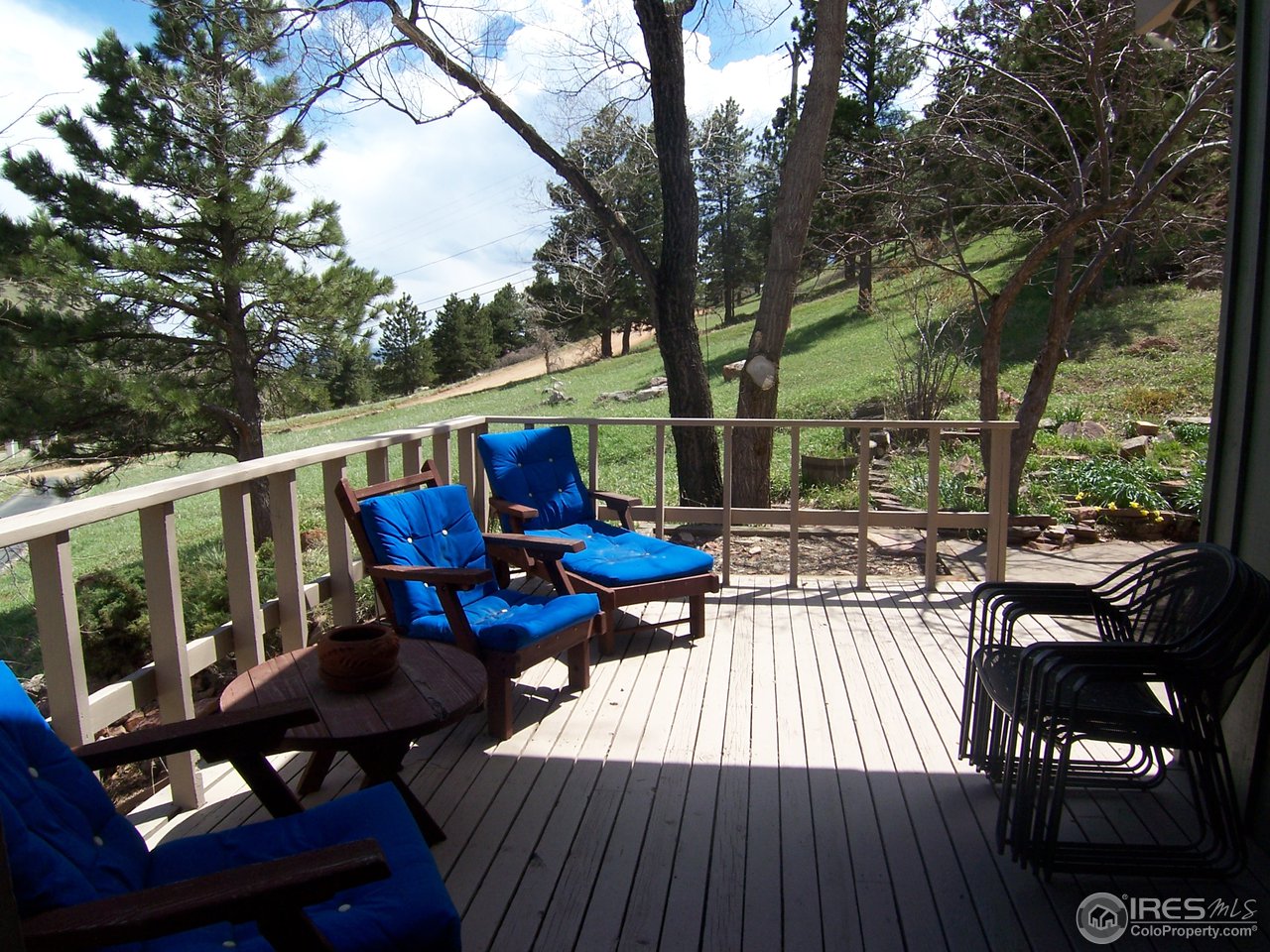 6419 Olde Stage Road Boulder, CO 80302 - Photo 17 of 21 a view of deck with furniture and trees around