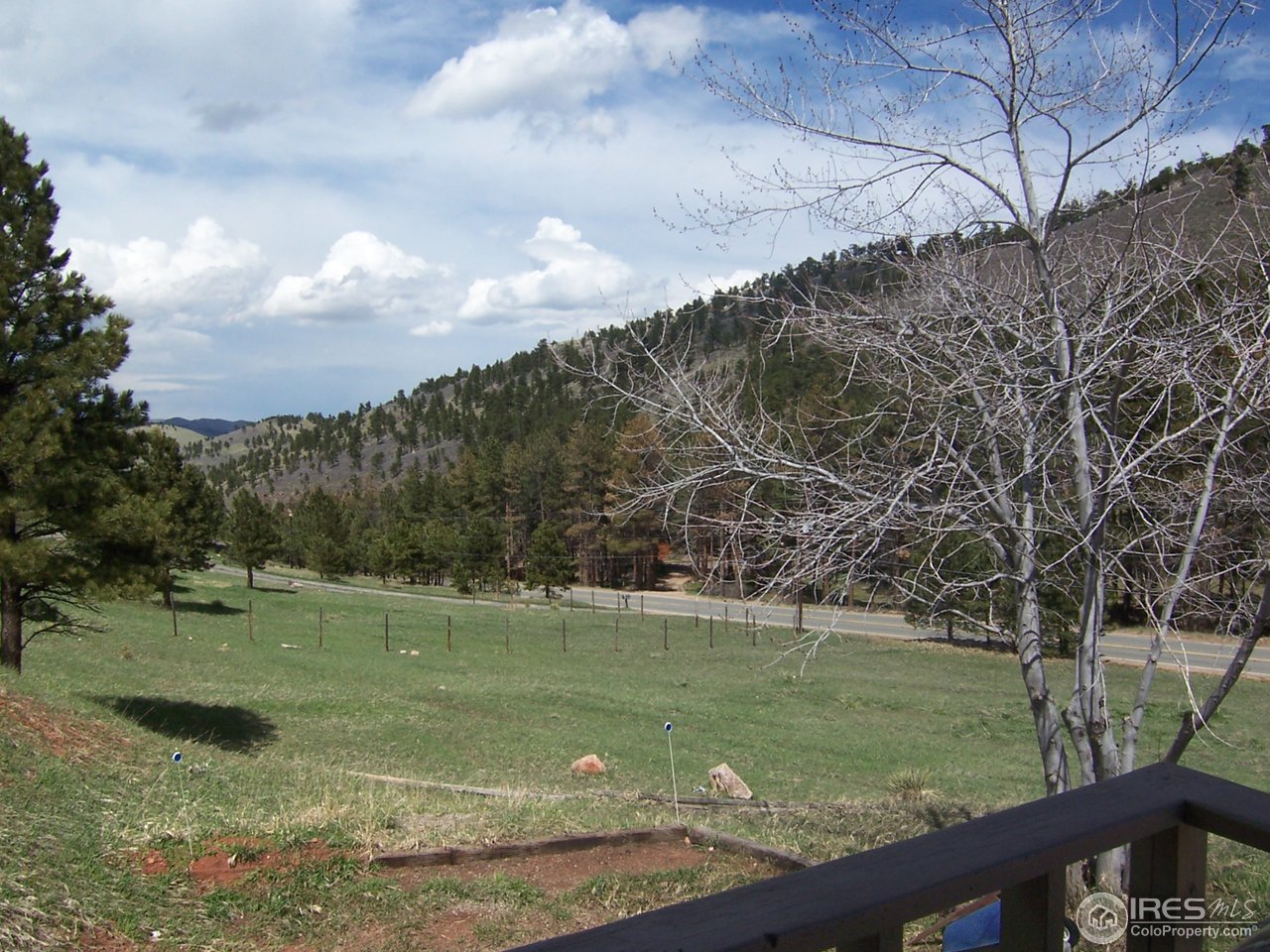 6419 Olde Stage Road Boulder, CO 80302 - Photo 19 of 21 a view of a golf course with a lake