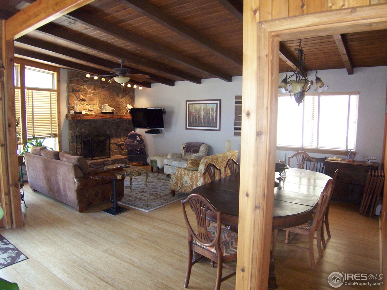 6419 Olde Stage Road Boulder, CO 80302 - Photo 2 of 21 a living room with furniture and a flat screen tv