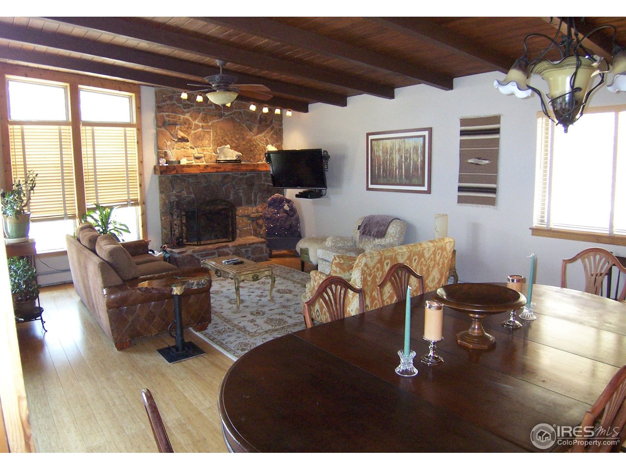 6419 Olde Stage Road Boulder, CO 80302 - Photo 4 of 21 a living room with furniture and a flat screen tv