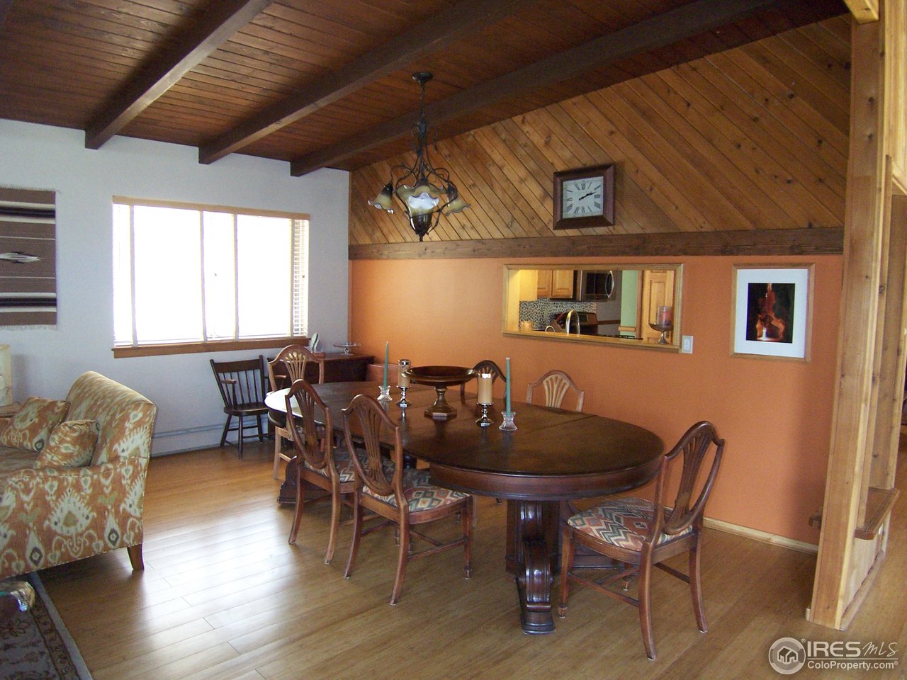 6419 Olde Stage Road Boulder, CO 80302 - Photo 5 of 21 a dining room with furniture window and wooden floor