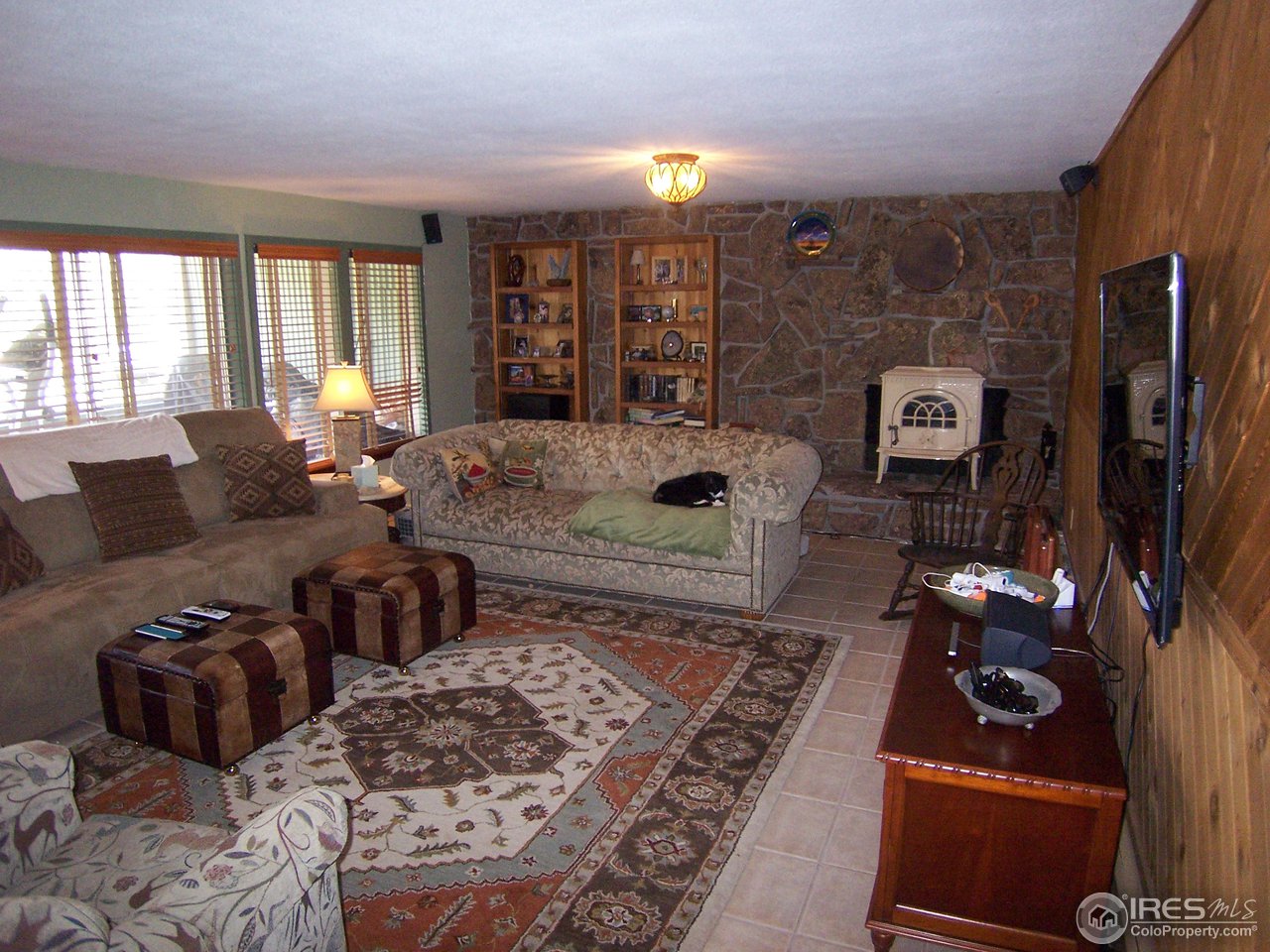 6419 Olde Stage Road Boulder, CO 80302 - Photo 8 of 21 a living room with furniture rug and window