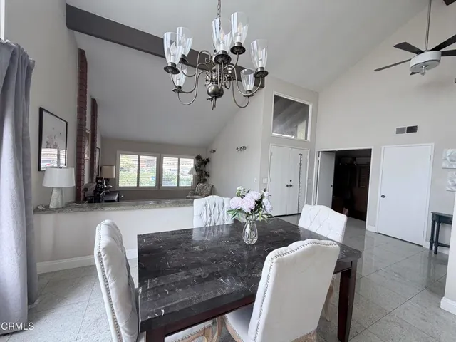 a kitchen with stainless steel appliances granite countertop a stove a sink dishwasher and a refrigerator