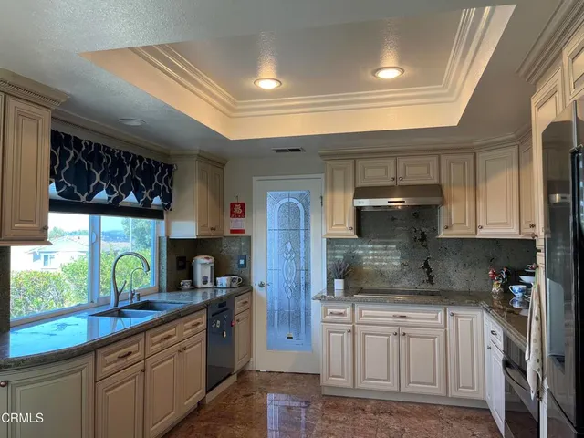 a view of a livingroom with furniture and a flat screen tv