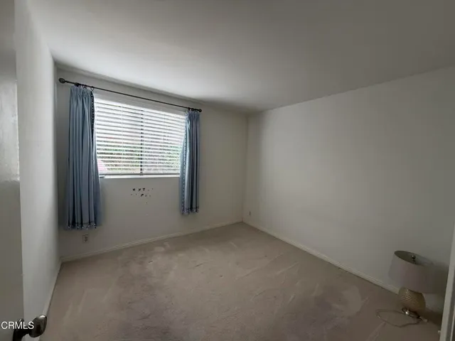 a view of a pathway with a yard