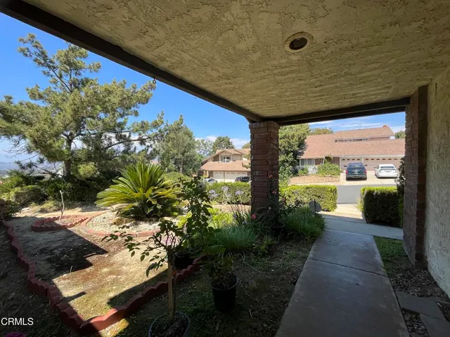 a view of a livingroom with furniture window and wooden floor