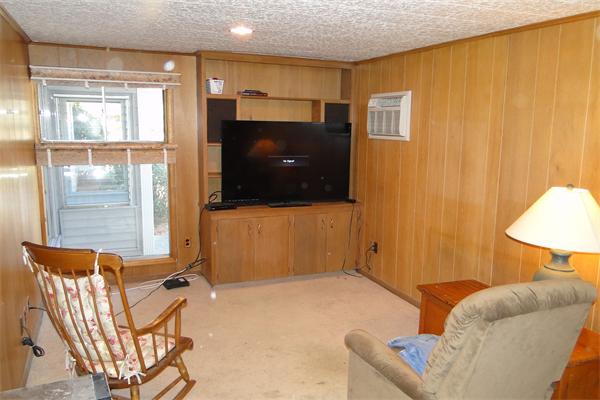42 Joseph Road Framingham, MA 01701 - Photo 10 of 15 a living room with a flat screen tv and a window