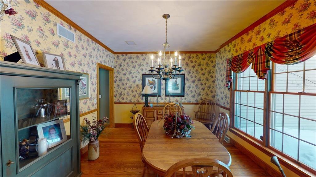 8271 Prindle Road Erie, PA 16510 - Photo 12 of 25 a view of a dining room with furniture window and wooden floor