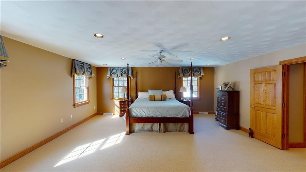 8271 Prindle Road Erie, PA 16510 - Photo 13 of 25 a bedroom with furniture and a window