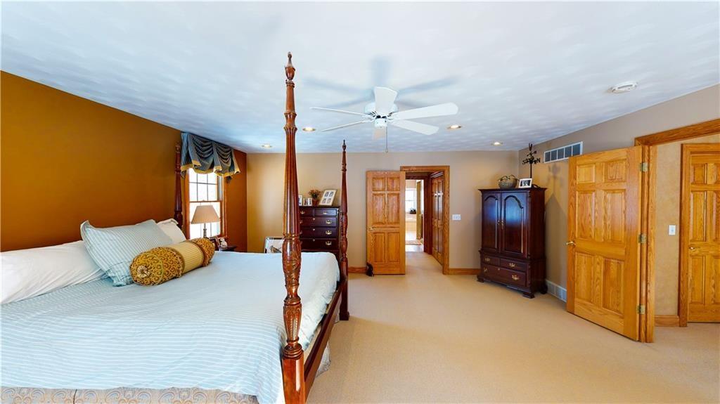 8271 Prindle Road Erie, PA 16510 - Photo 14 of 25 a bedroom with furniture and a window