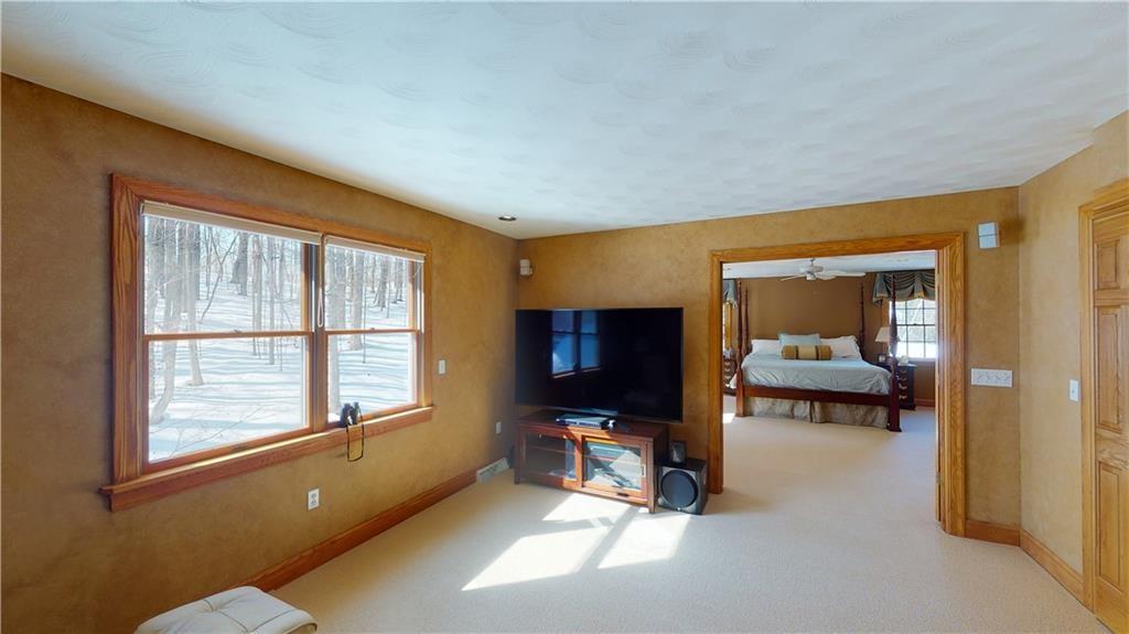 8271 Prindle Road Erie, PA 16510 - Photo 15 of 25 a living room with furniture and a flat screen tv