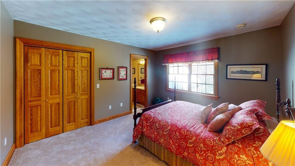 8271 Prindle Road Erie, PA 16510 - Photo 18 of 25 a bedroom with a bed and a window