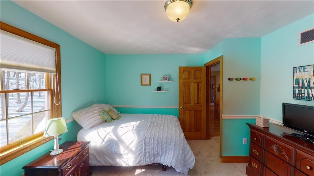 8271 Prindle Road Erie, PA 16510 - Photo 19 of 25 a bedroom with a bed and a window