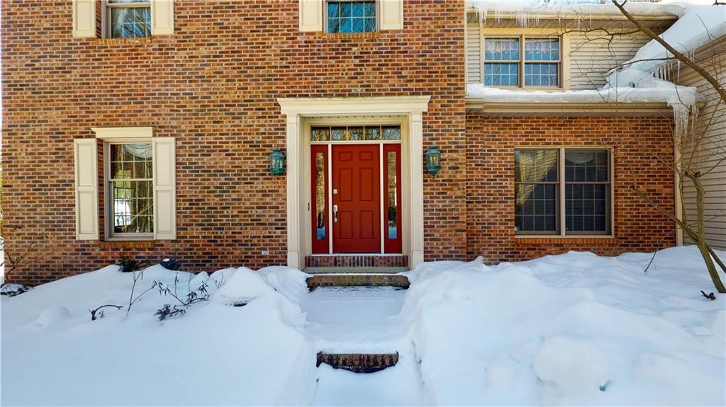 8271 Prindle Road Erie, PA 16510 - Photo 2 of 25 a front view of a house with a yard