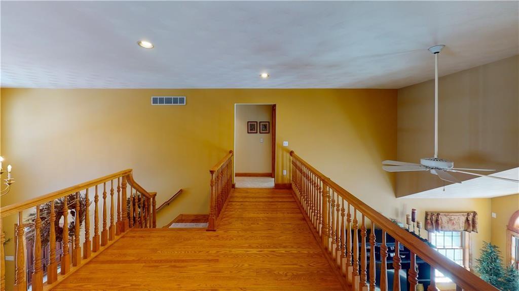 8271 Prindle Road Erie, PA 16510 - Photo 21 of 25 a view of a hallway with wooden floor