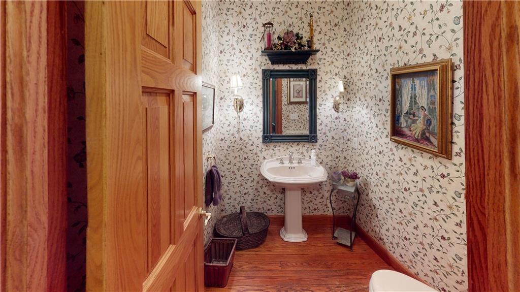8271 Prindle Road Erie, PA 16510 - Photo 22 of 25 a bathroom with a sink and a mirror