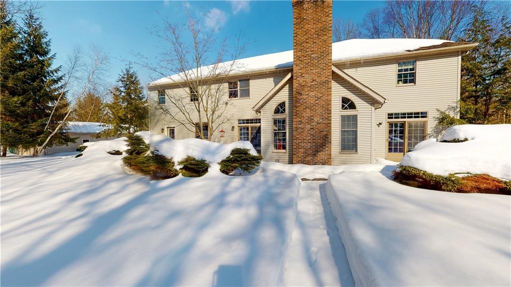 8271 Prindle Road Erie, PA 16510 - Photo 3 of 25 a view of a house with a yard covered in snow