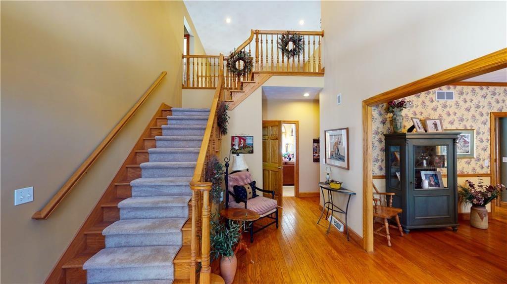 8271 Prindle Road Erie, PA 16510 - Photo 4 of 25 a view of entryway and hall with wooden floor