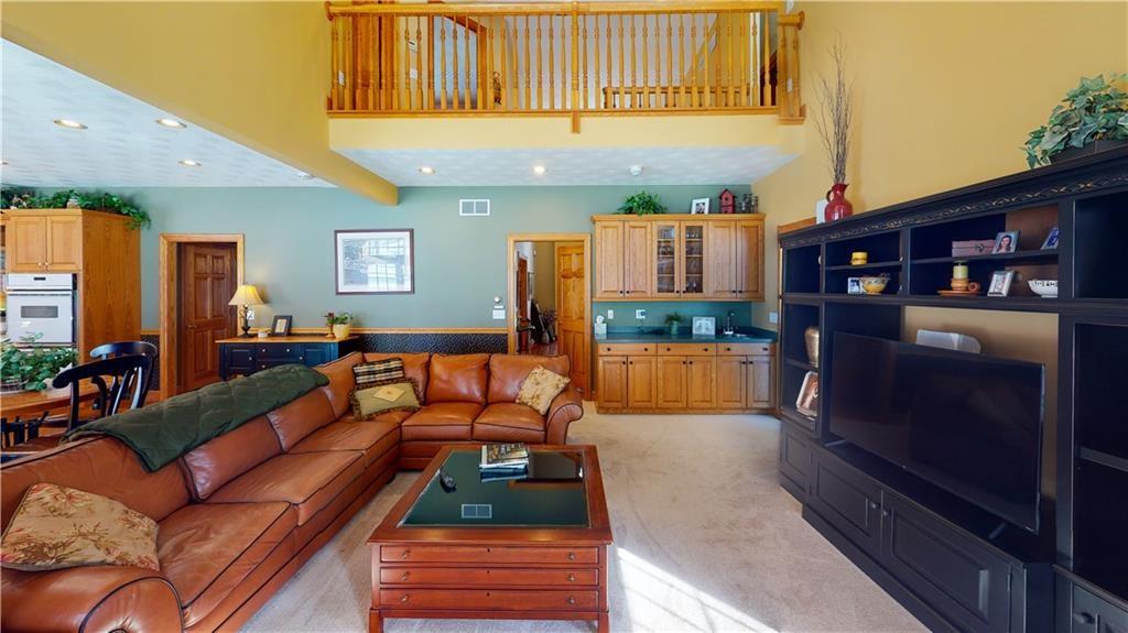8271 Prindle Road Erie, PA 16510 - Photo 8 of 25 a living room with furniture and a wooden floor