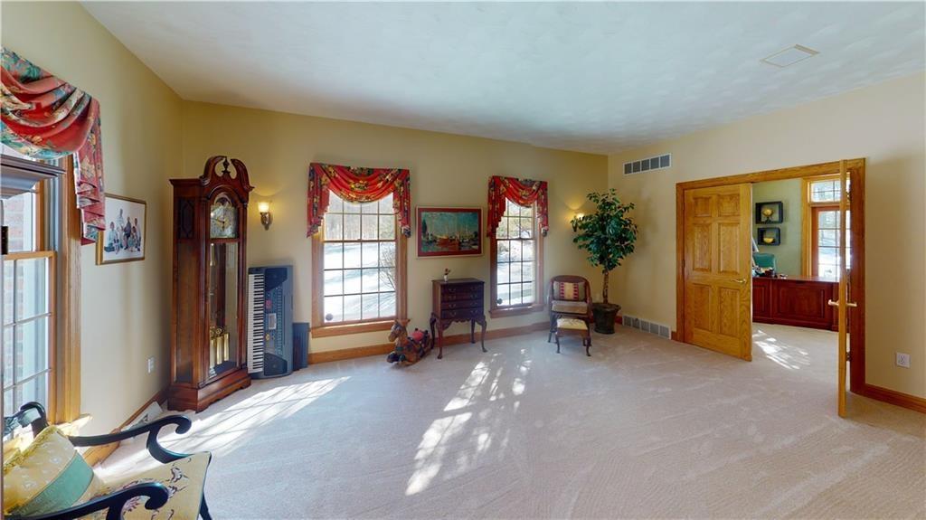 8271 Prindle Road Erie, PA 16510 - Photo 10 of 25 a view of a livingroom with furniture and a flat screen tv