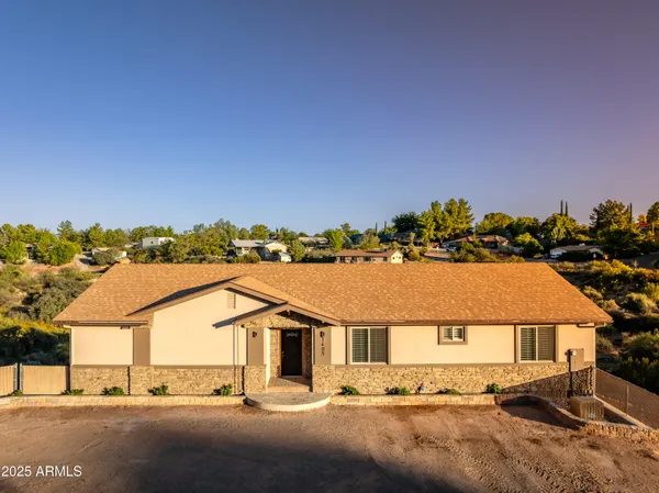 an aerial view of residential houses with outdoor space and street view