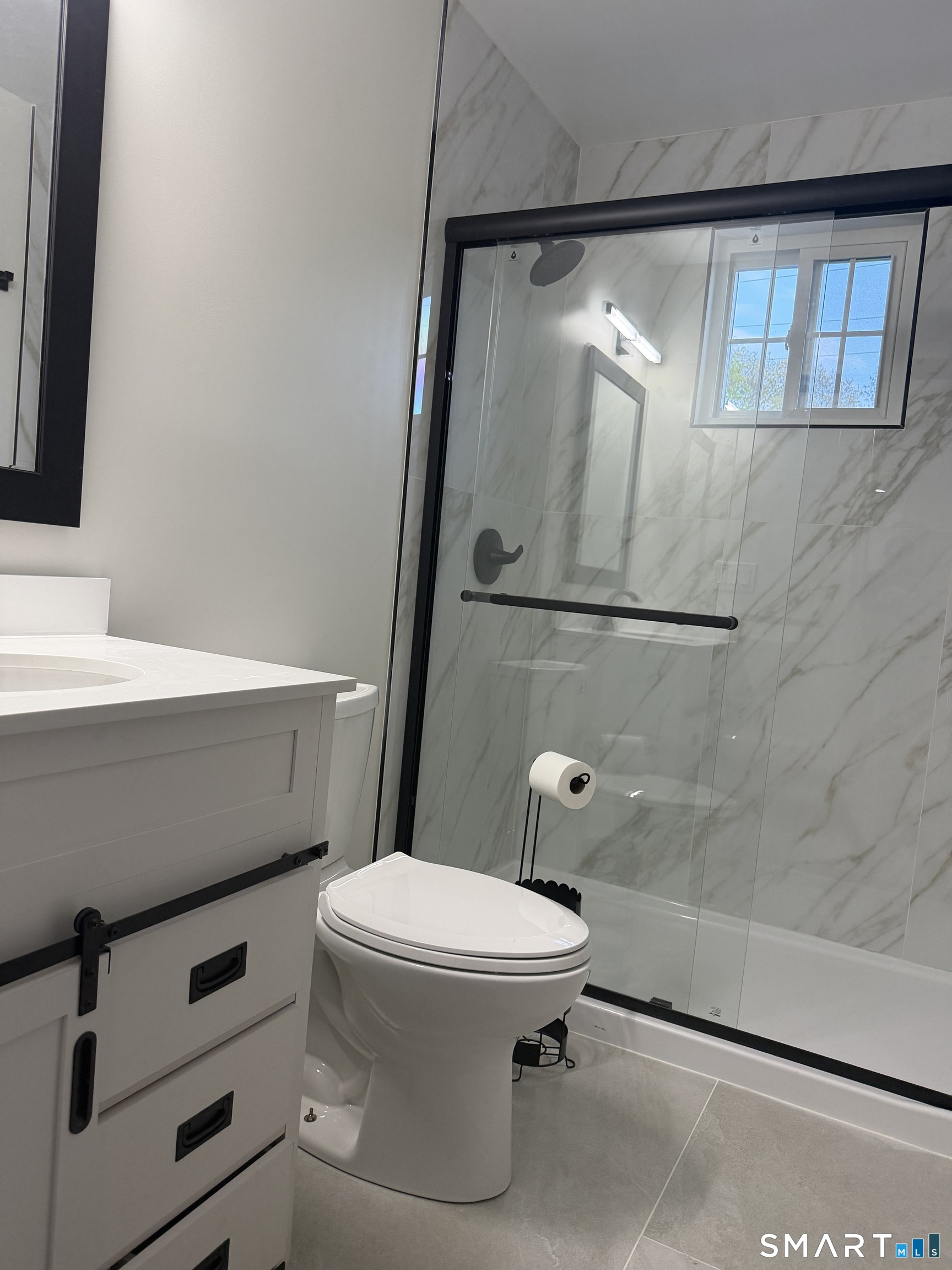 11 Strant Street Manchester, CT 06040 - Photo 3 of 8 a bathroom with a toilet and a shower