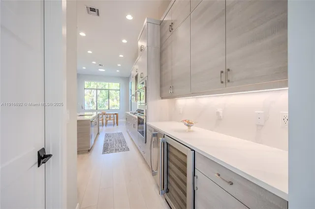 a view of a dining room with furniture and a window