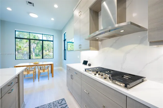 a bed room with a bed and large window