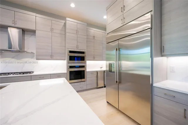 a view of yard with swimming pool and lawn chairs under large tree
