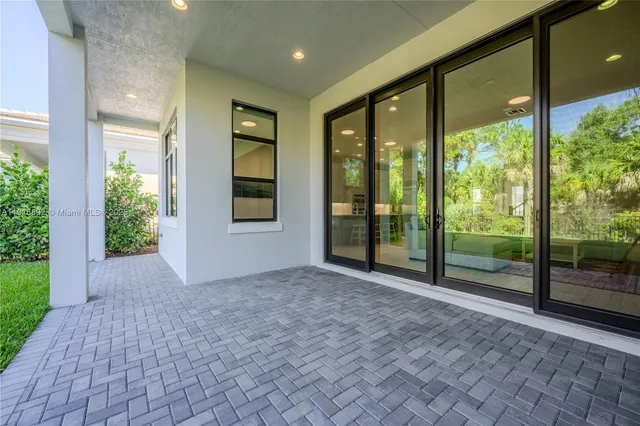 a bedroom with a large bed and a couch