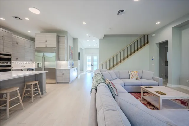 a bedroom with a bed and a night stand