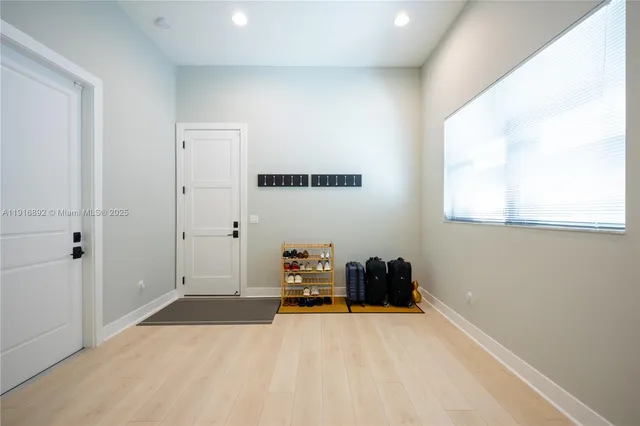 a view of cabinets a sink and a window in a kitchen