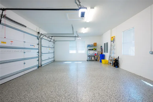 an aerial view of a house with a yard and potted plants